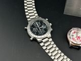a close up of a watch on a table next to a box