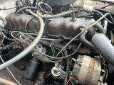 an image of a close up of a car engine with a lot of wires
