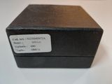 a black box with a label on it on a table