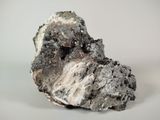 a close up of a rock on a white surface