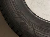 a close up of a tire on a white surface