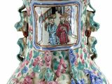 a vase with a picture of a man and a woman on it