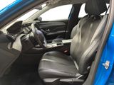 the interior of a blue car with black leather seats and a steering wheel