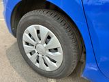 a close up of a tire on a blue car