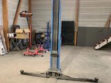 an image of a garage with a car lift in it