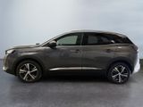 the grey car is parked in a large room with a gray floor