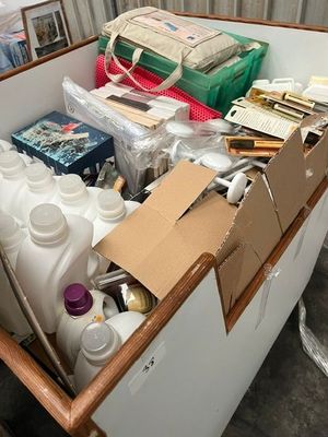 a large box full of bottles and containers in a room