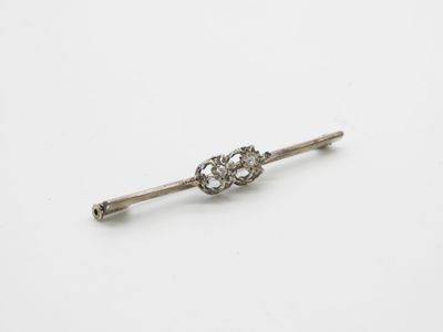 a close up of a small metal object on a white surface