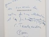 an open book with a handwritten note on the front of it