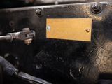 a close up of a metal object with a yellow label on it