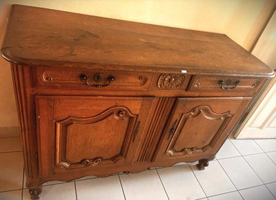 a large wooden cabinet with two drawers and a door