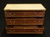 an image of a wooden chest of drawers on a black background
