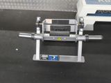 a machine that is sitting on the floor next to a box