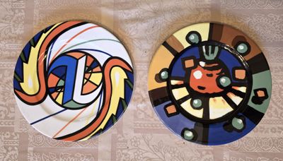 two plates that are sitting on a table