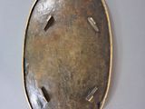 a picture of a metal object on a white surface