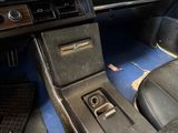 a car dashboard with a small button on the center console