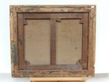 an old wooden easel with a painting on top of it