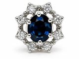a close up of a blue sapphire and diamond ring on a white background