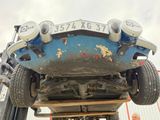 a blue car that is sitting on top of a truck