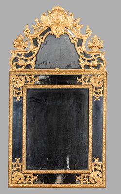 an image of a mirror with a gold frame and a black background