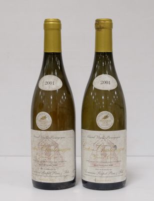 two bottles of wine sitting next to each other on a table