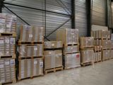 a lot of boxes stacked on pallets in a warehouse
