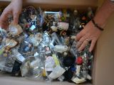 a person holding a box full of assorted items