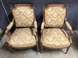 pair of antique chairs with upholstered upholstered arms