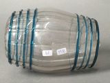 a clear glass jar with a blue band around it