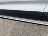 a close up of the side of a white car