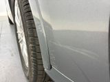 a close up of a car ' s front bumper with scratches on it