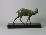 bronze statue of a deer on a black base on a white background