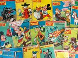 a lot of cartoon books that are on the table