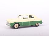 a green and white toy car on a white surface