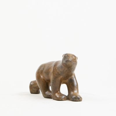 statue of a brown bear on a white background