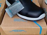 a pair of shoes that are on top of a box
