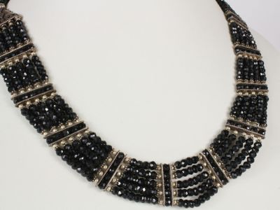 a close up of a necklace on a mannequin mannequin