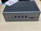a small computer sitting on top of a wooden table