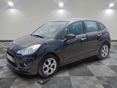 a picture of a black car parked in a garage