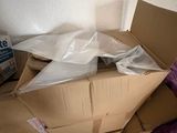 a pile of boxes sitting on the floor in a room