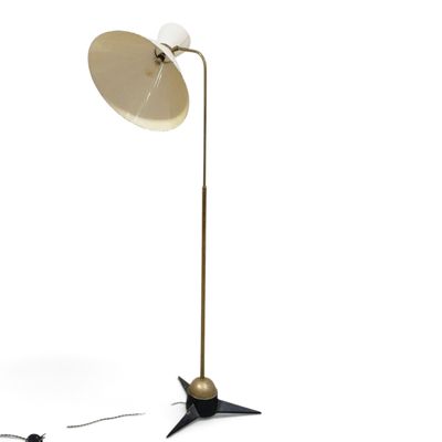 the floor lamp is next to a mouse on a white surface