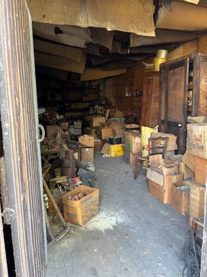 a garage with a lot of boxes and boxes on the floor