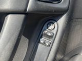 a close up of a car ' s door handle with the door handle open