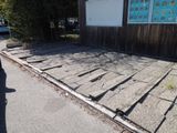 a wooden walkway that has been laid out on the side of the road