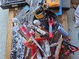 a pile of tools on a pallet on the floor
