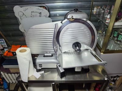 an image of a commercial meat slicer in a store