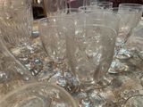 a lot of empty wine glasses sitting on a table