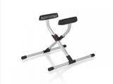 une photo d'un tabouret pliant blanc et noir, avec une assise noire