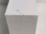 a close up of a white box with a hole in it