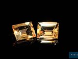 two square cut yellow sapphires on a black background